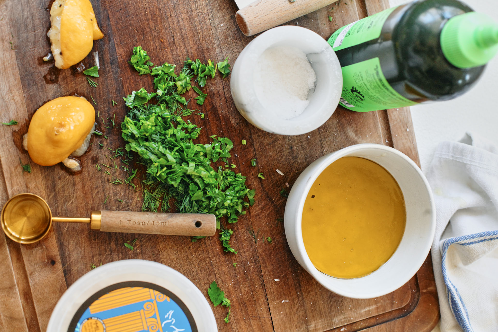 mixing the roasted lemon vinaigrette