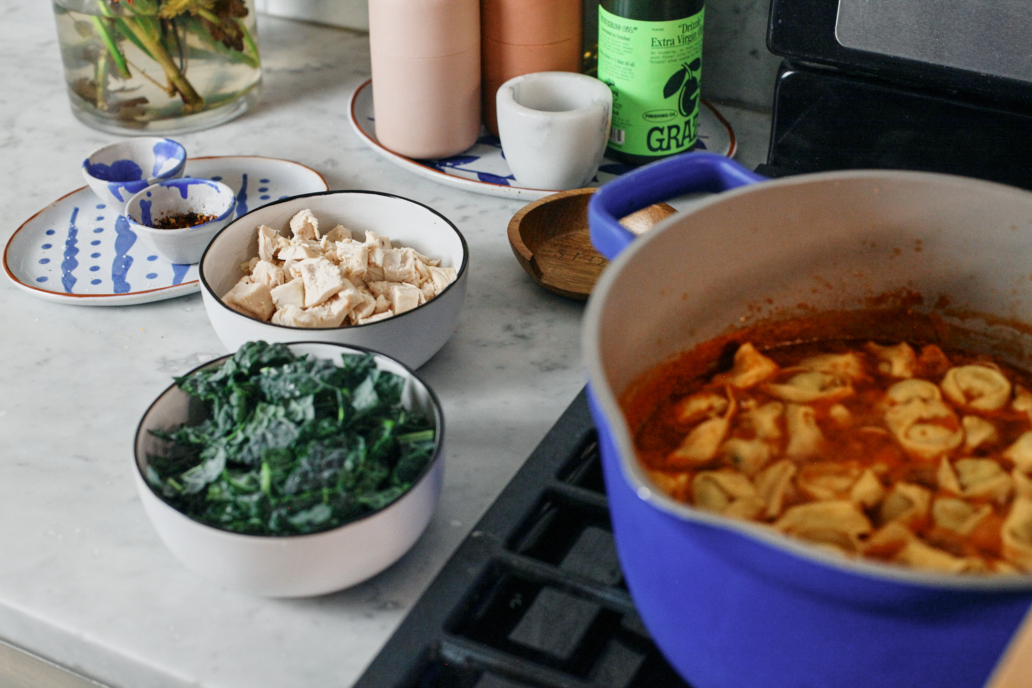 about to add chopped kale and chicken to tuscan tortellini soup