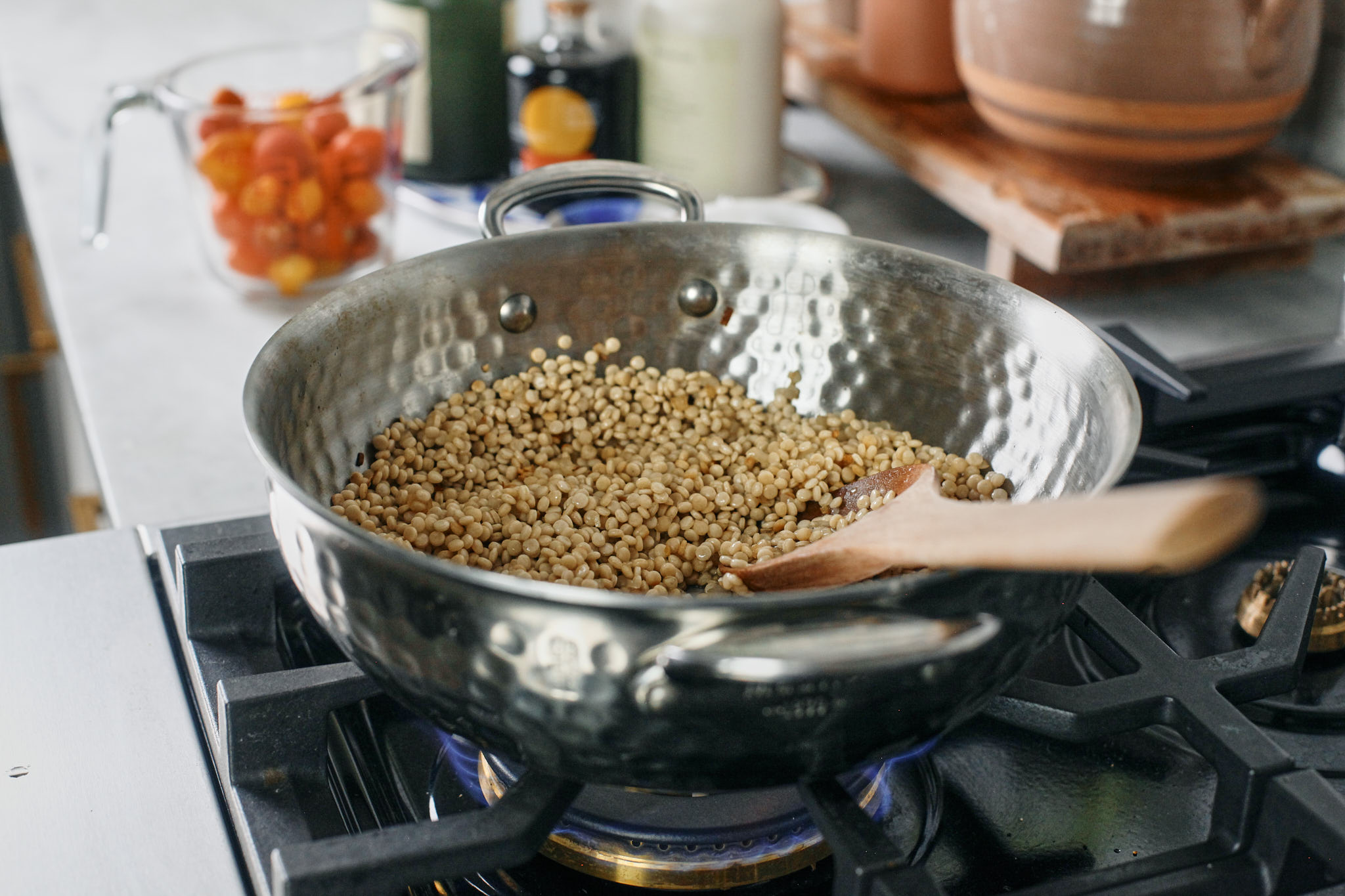 pearl couscous cooking on the stove