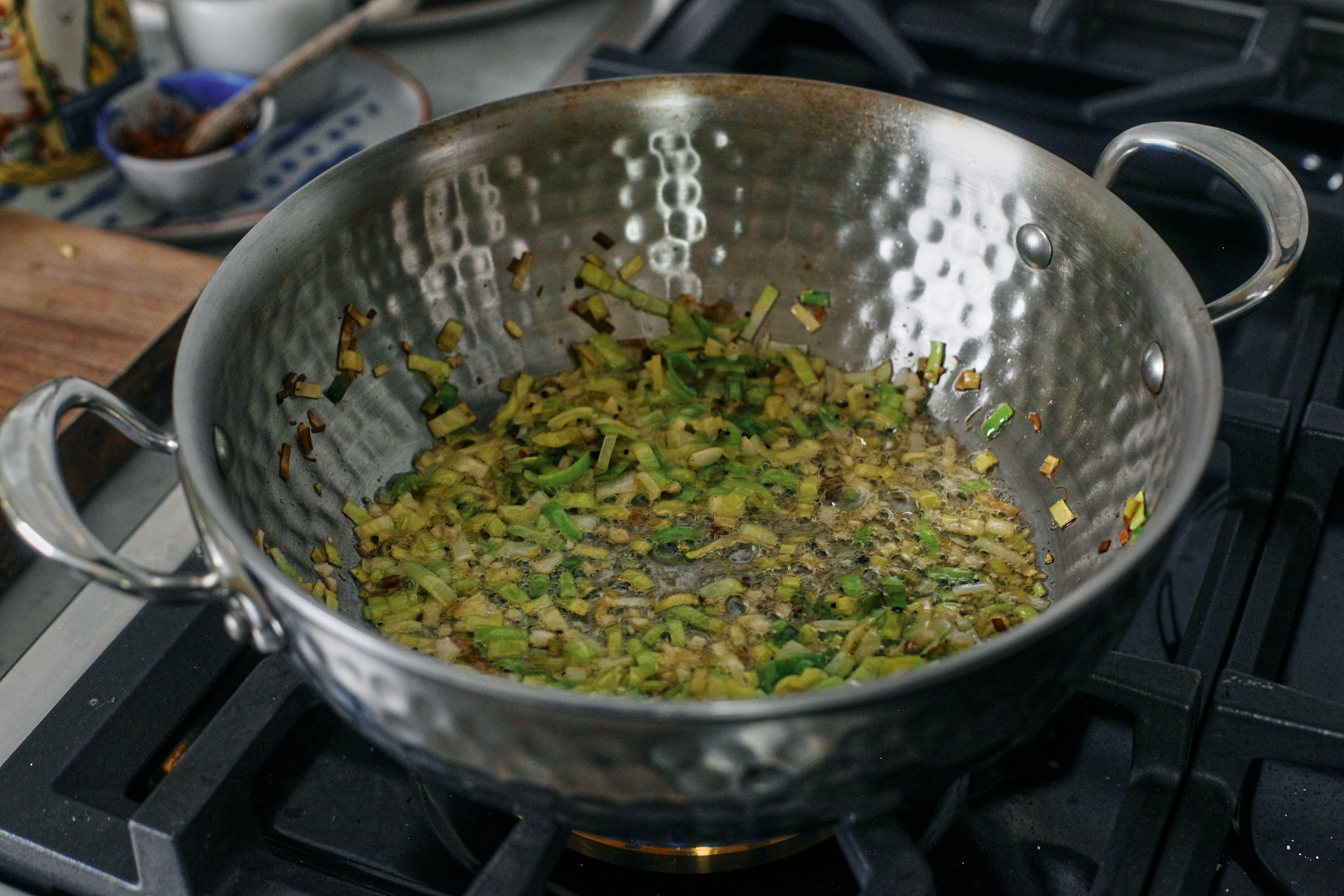 sautées chopped leeks and garlic