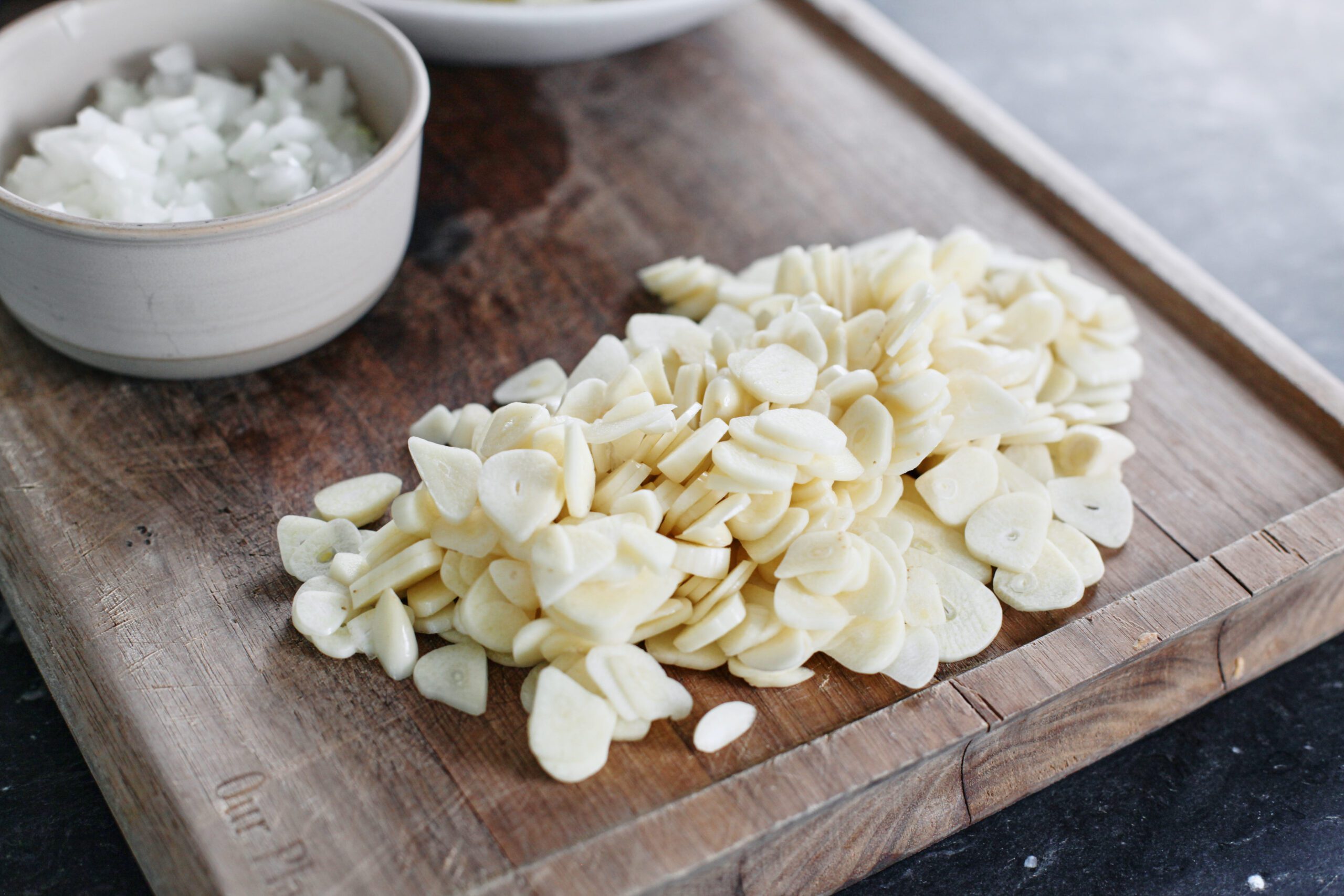 a pile of thinly sliced garlic