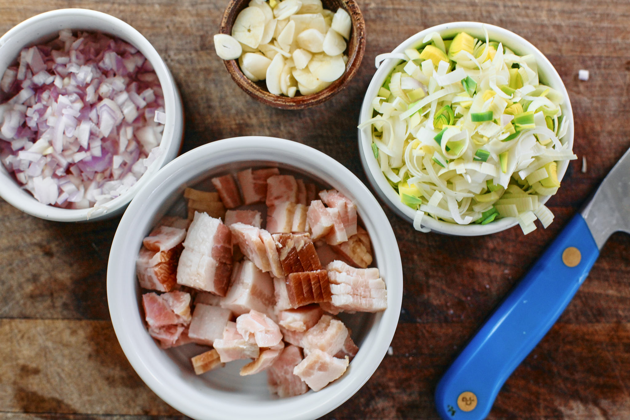 prep for the toasted orzo potato leek soup - chopped shallot, leek, garlic and bacon.
