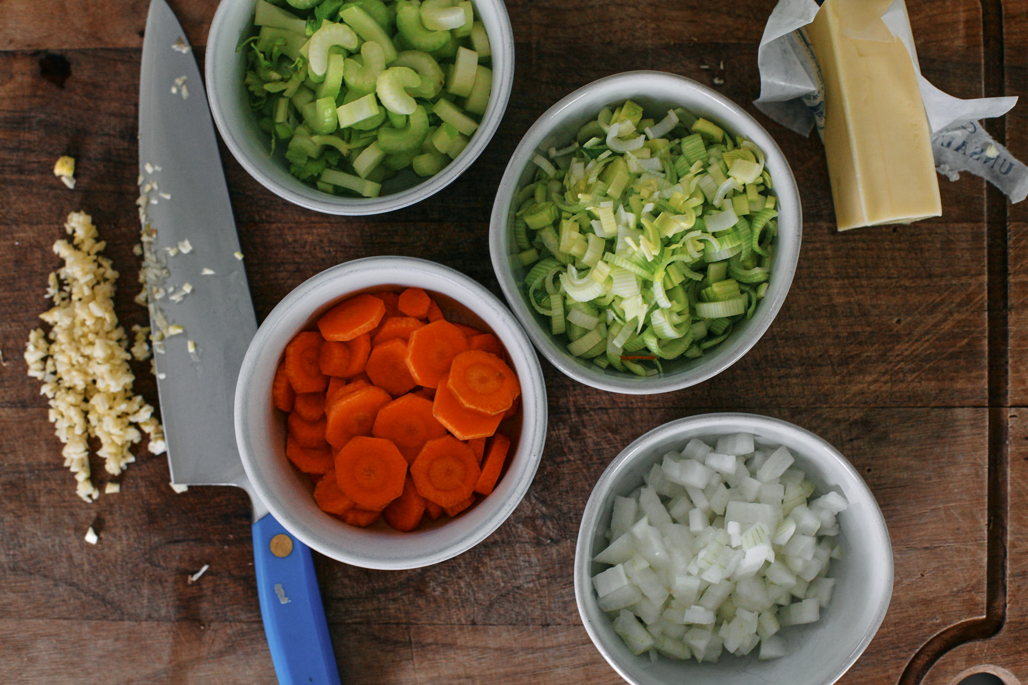 chopped celery, carrots, onion, leek and garlic - prep for the best creamy chicken noodle soup