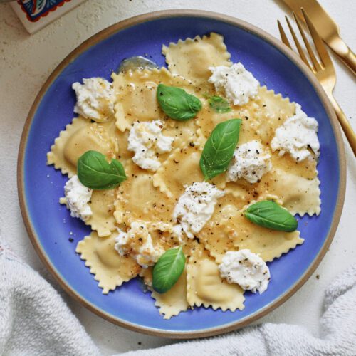 burrata & lemon ravioli, plated with basil and lemon zest