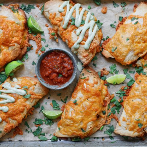 Bacon and Egg Sheet Pan Tacos drizzled with avocado lime crema