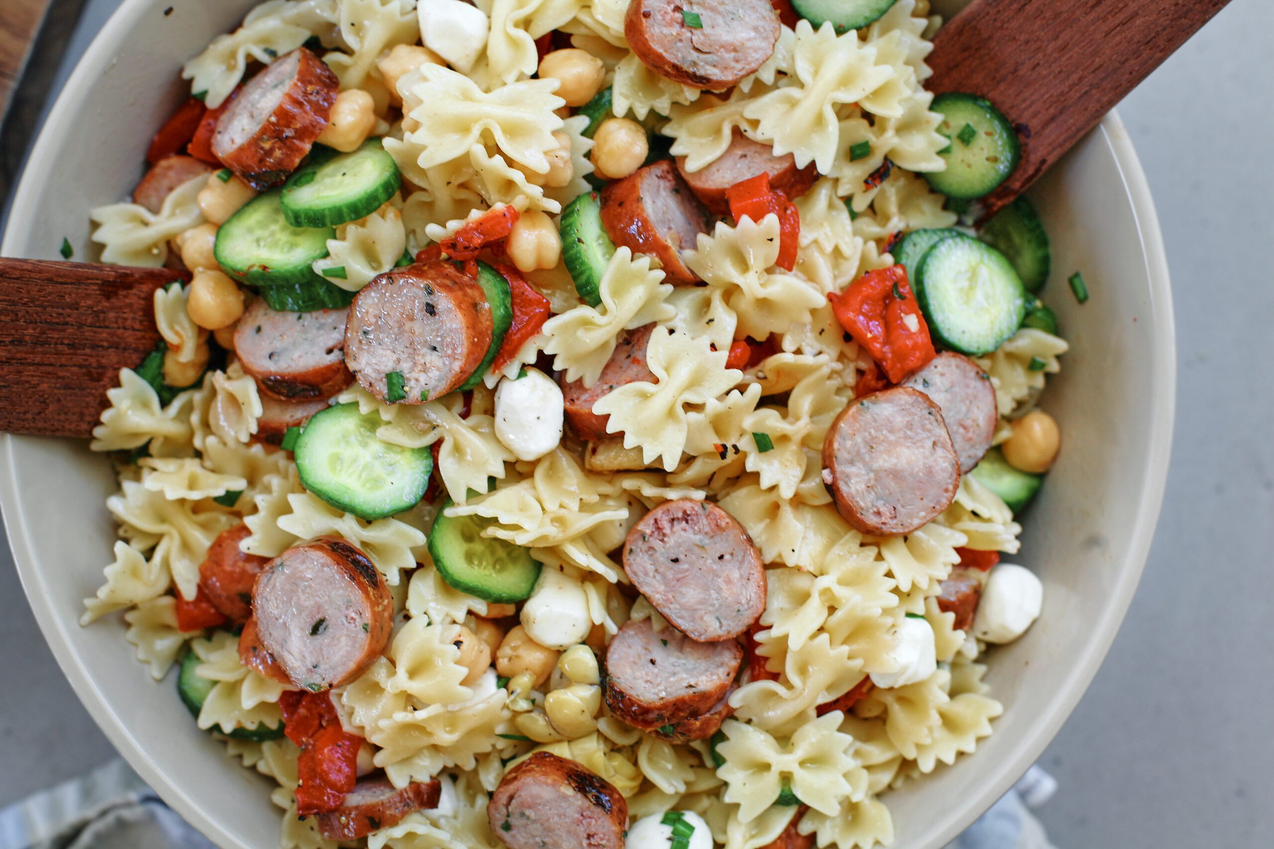 high protein pasta salad in a large bowl, tossed to combine