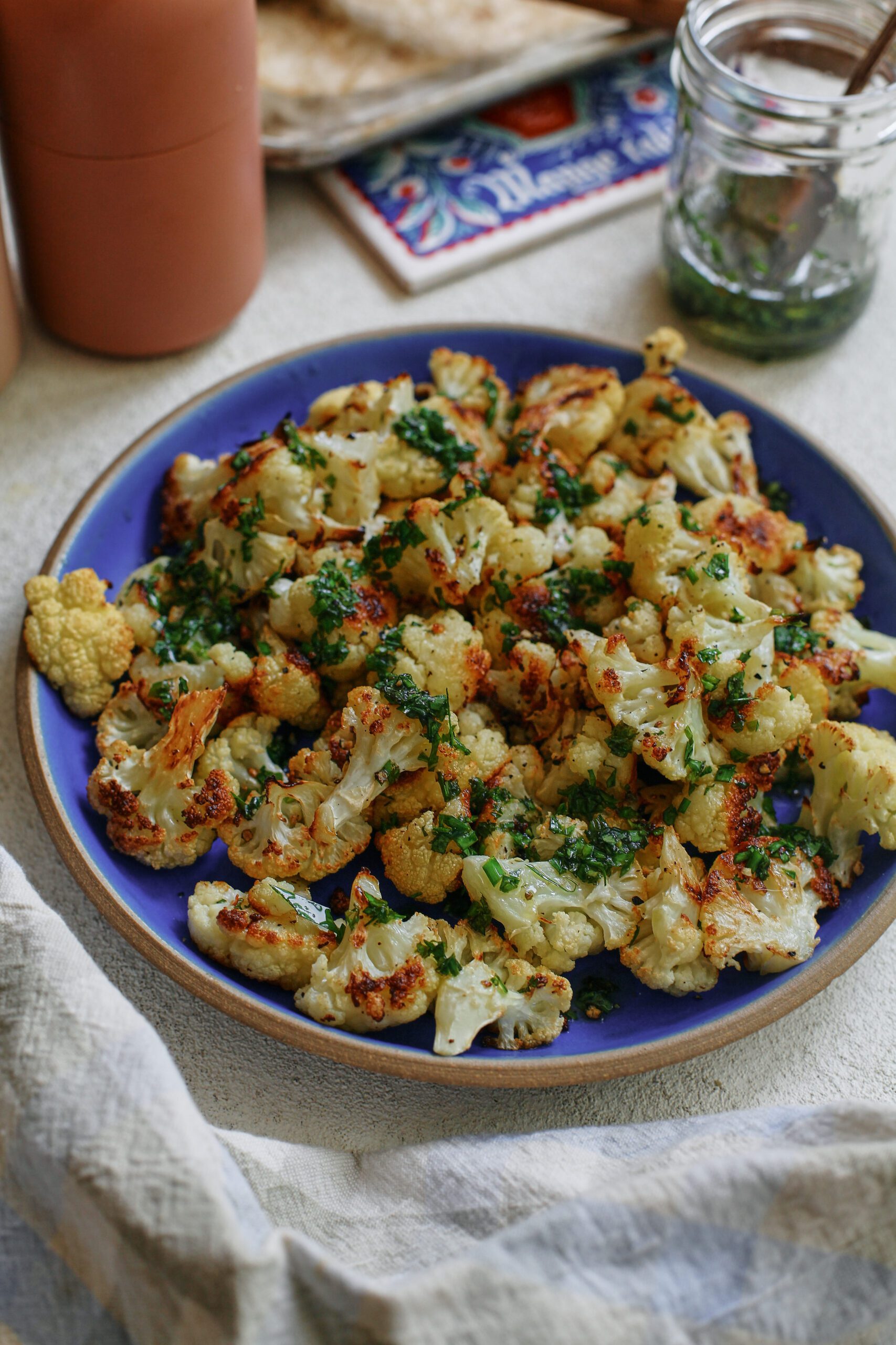 salt and vinegar cauliflower on a blue plate