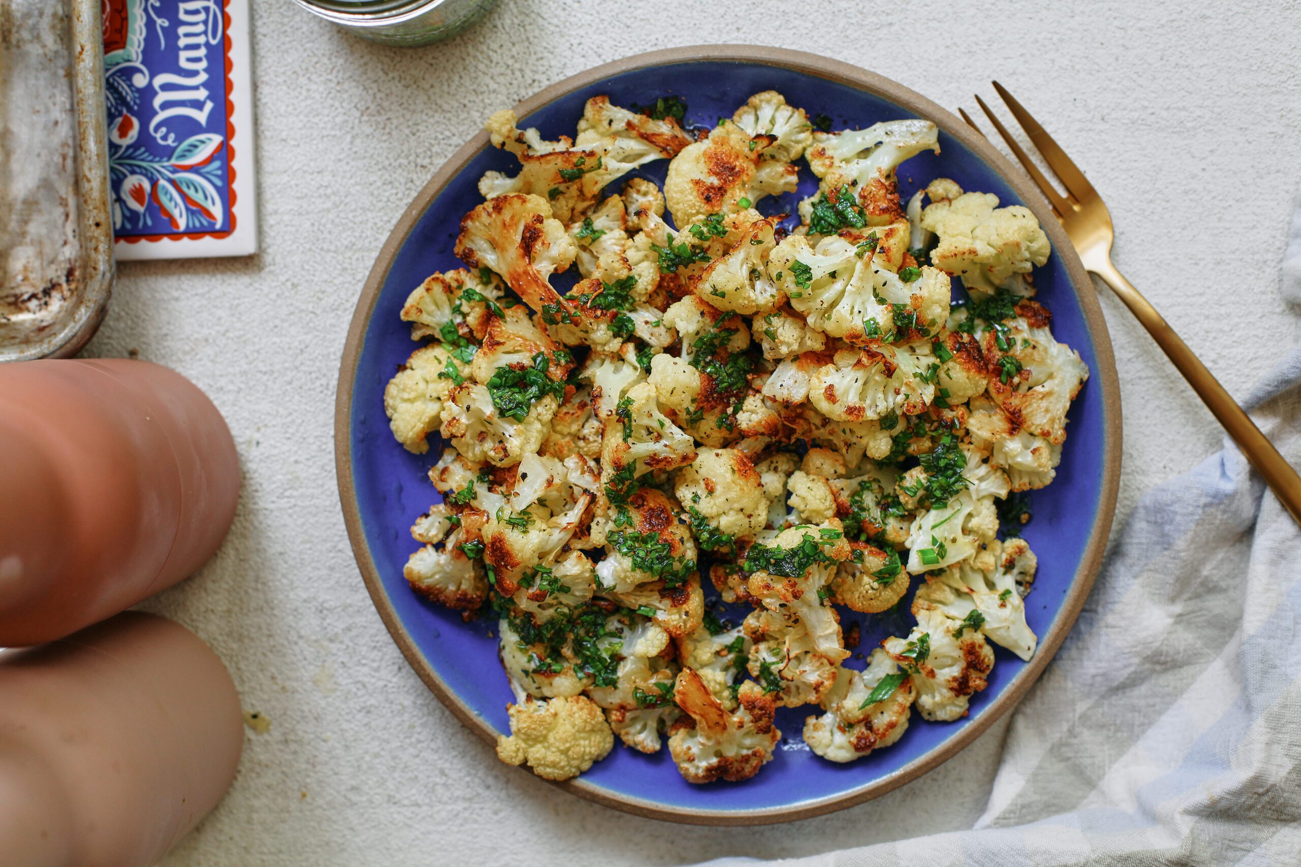 salt and vinegar cauliflower on a blue plate