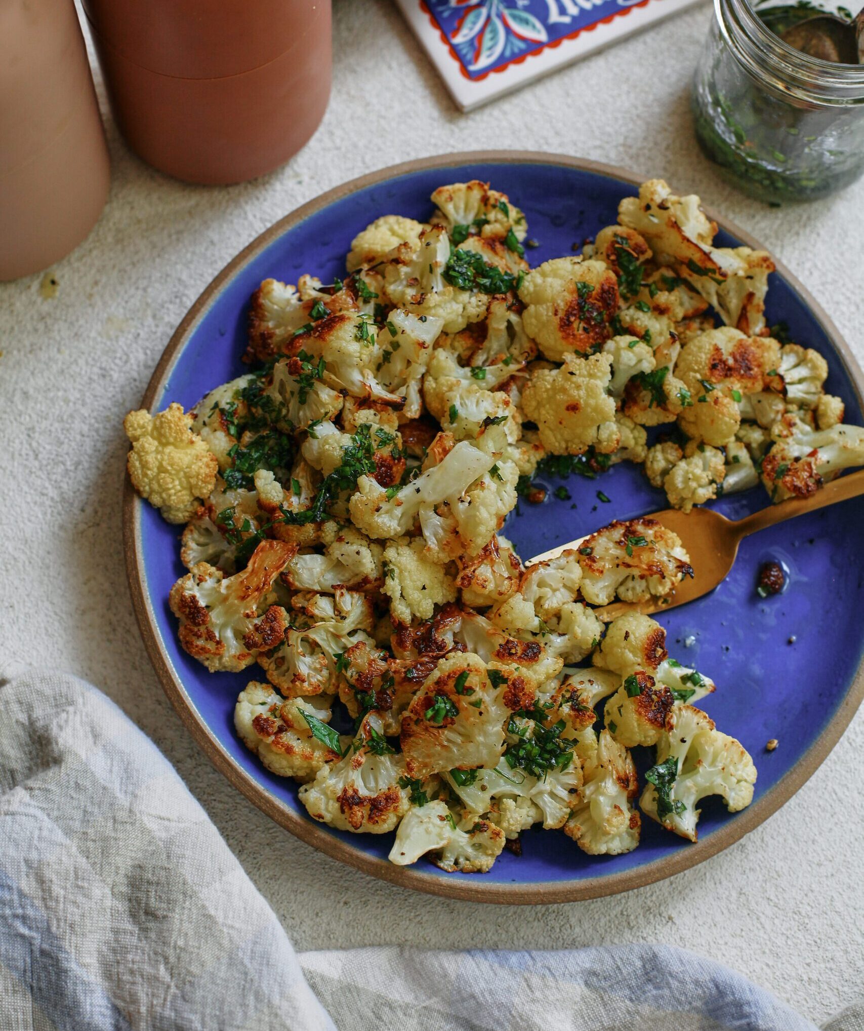 salt and vinegar cauliflower on a blue plate