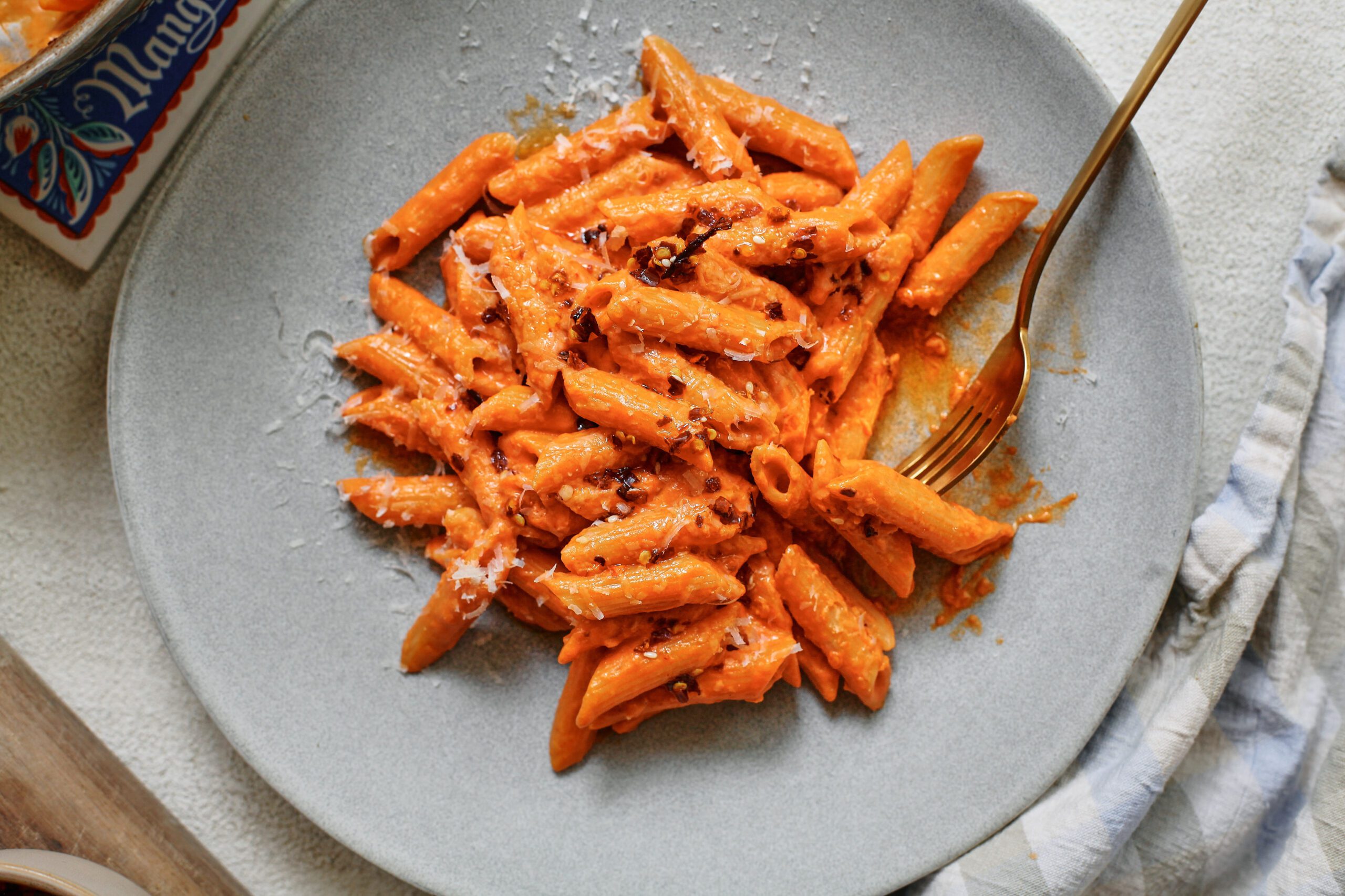 chili oil penne alla vodka 14 chili oil penne alla vodka on a plate with a gold fork