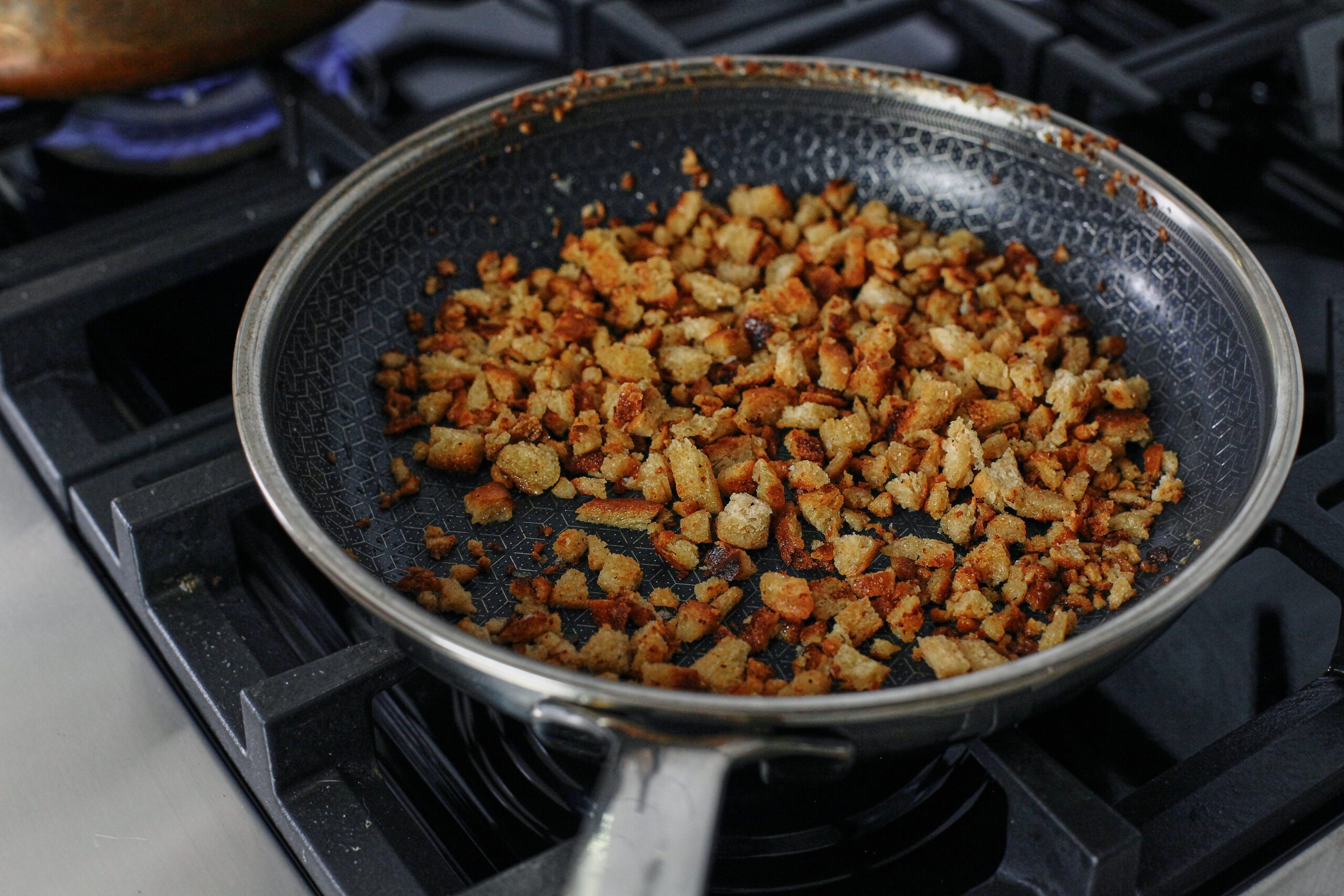 breadcrumbs toasting in a pan