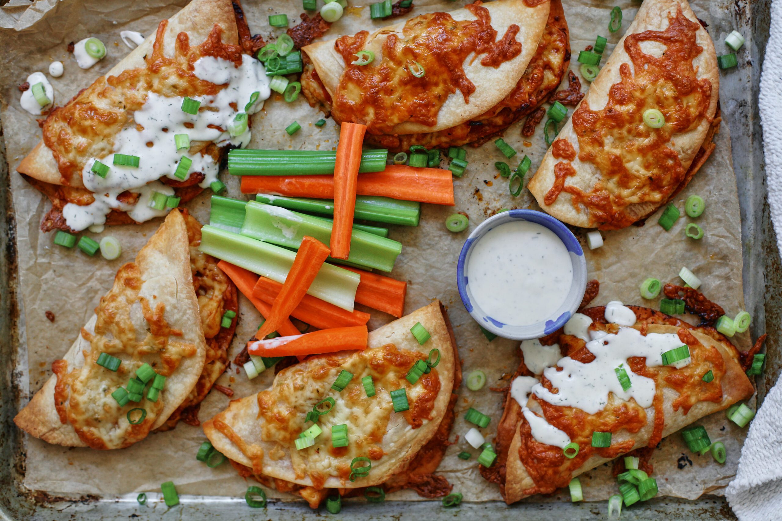 buffalo chicken sheet pan tacos with homemade ranch dressing and celery and carrot sticks