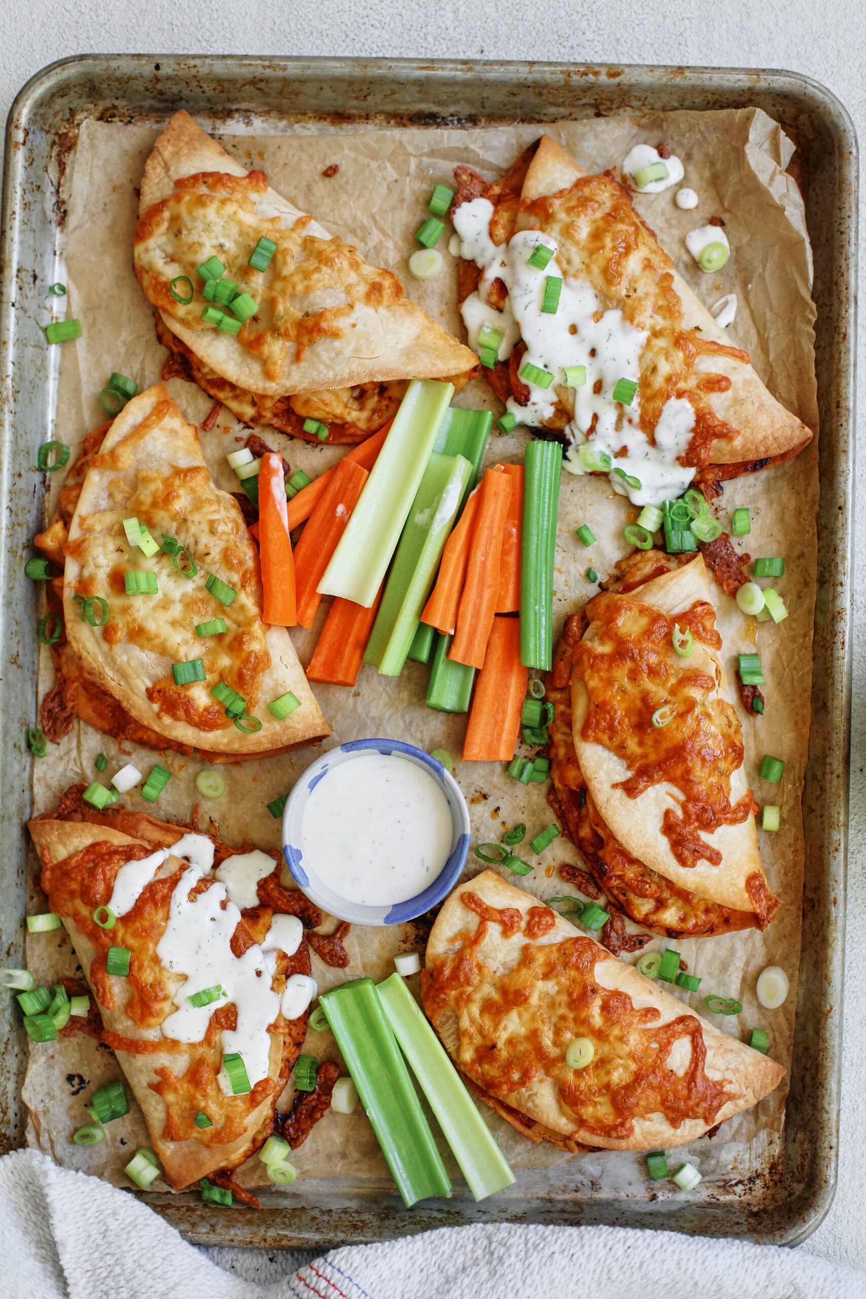 buffalo chicken sheet pan tacos with homemade ranch dressing and celery and carrot sticks