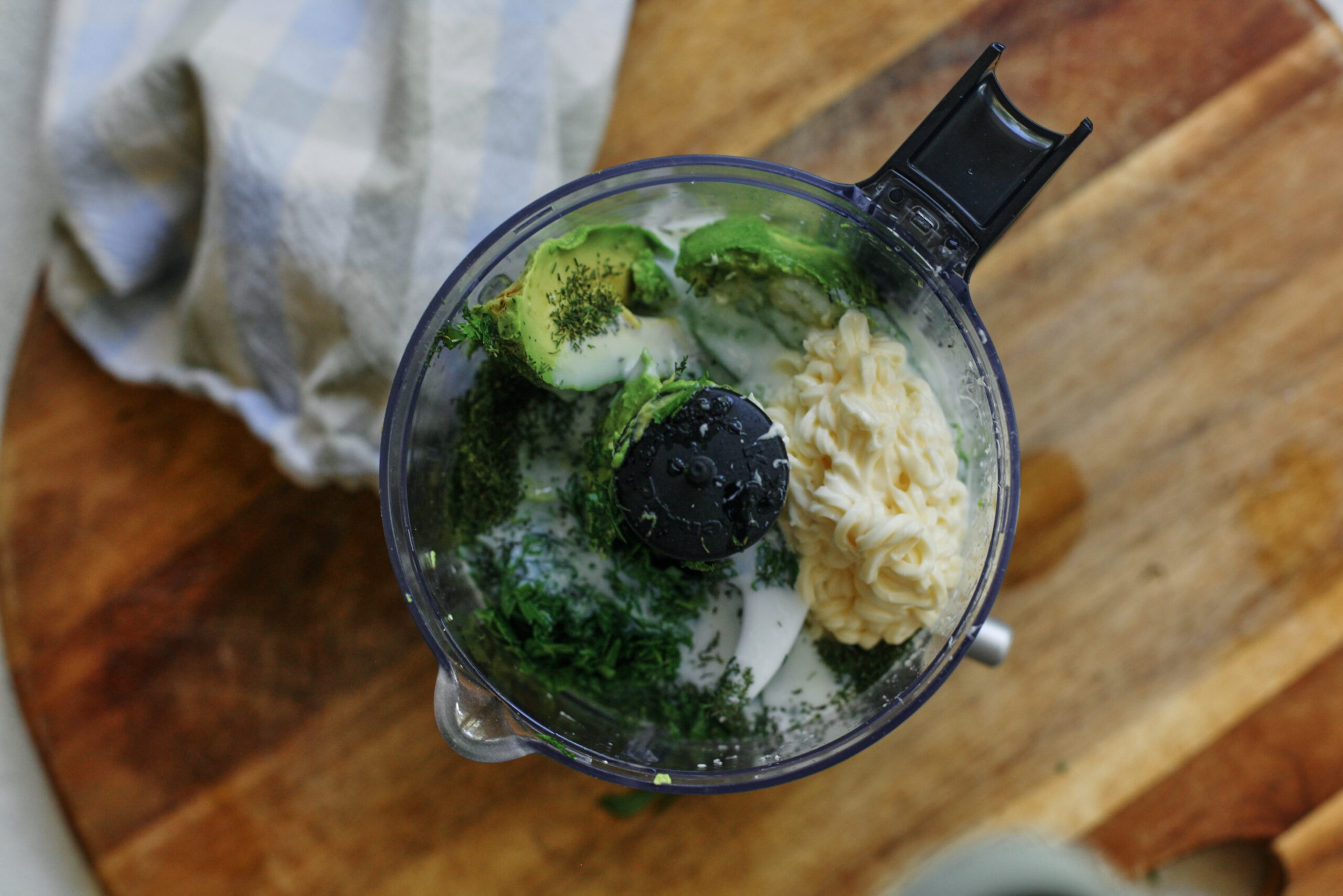ingredients for the green goddess ranch: avocado, cilantro, dill, buttermilk, lime, salt, mayonnaise.