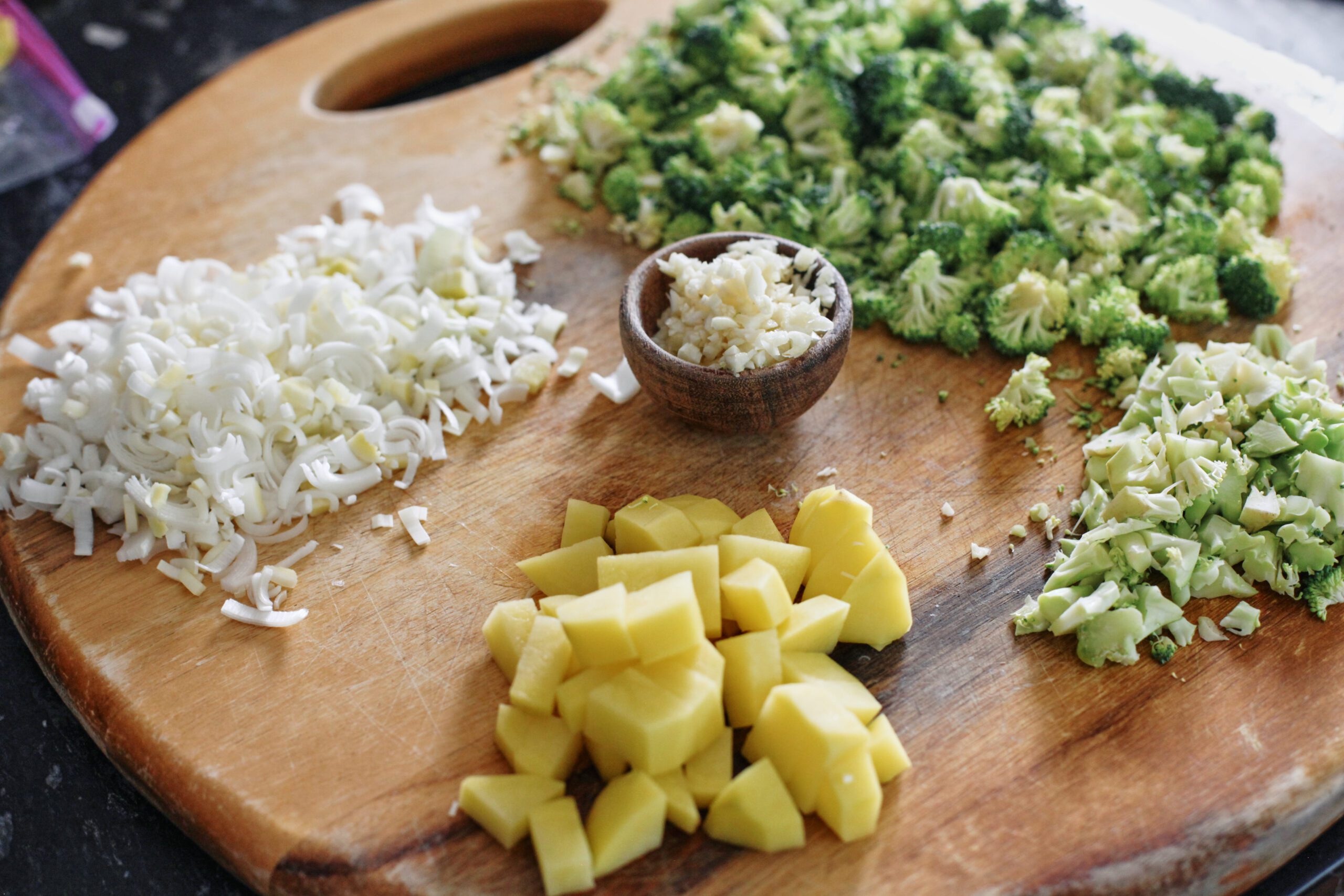prep for the broccoli cheddar orzo soup: chopped leek, broccoli florets, broccoli stems, potato, garlic