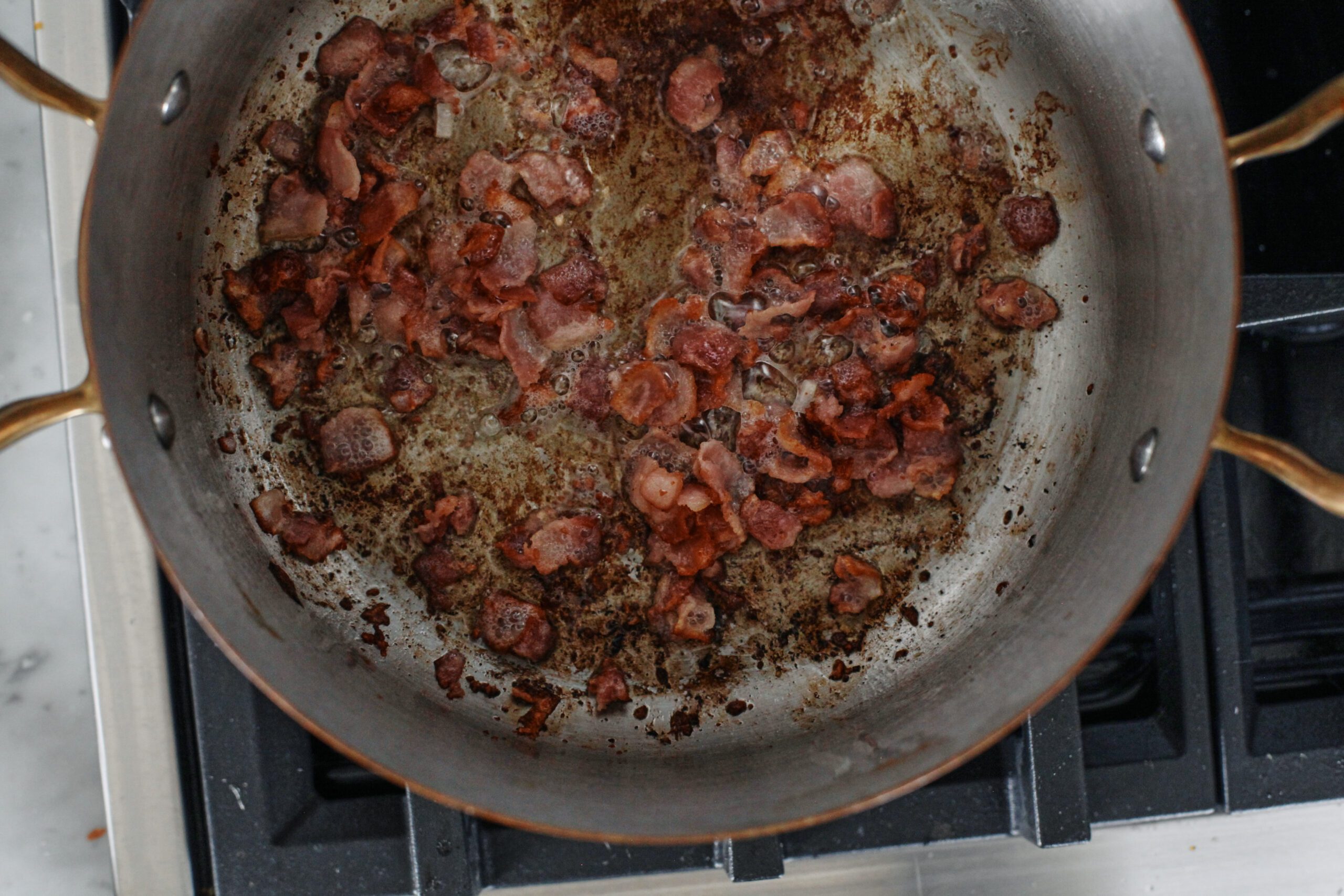 bacon browning in a pot