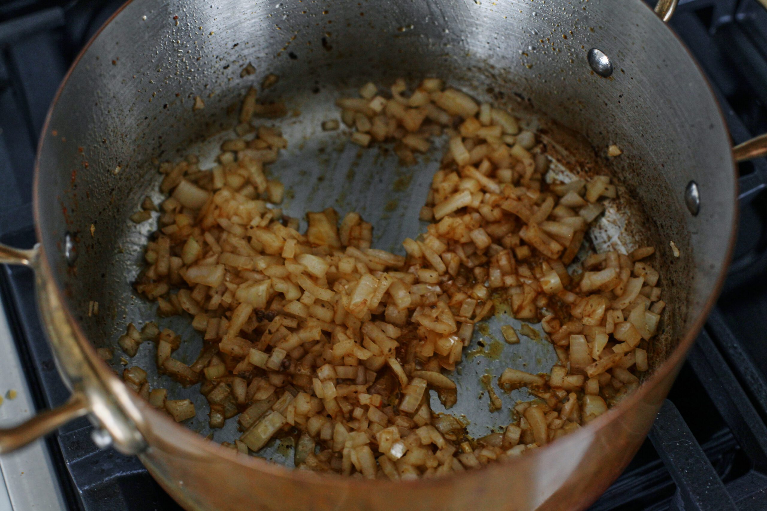 onion sautéing in a pot