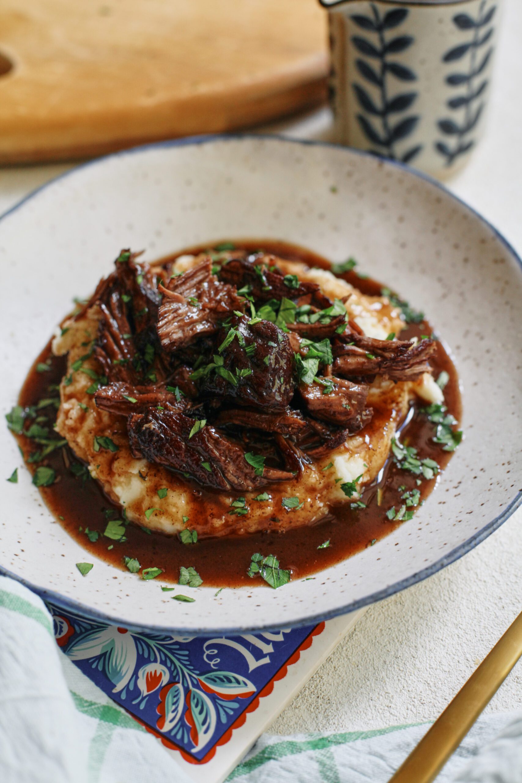 braised beef over mashed potatoes
