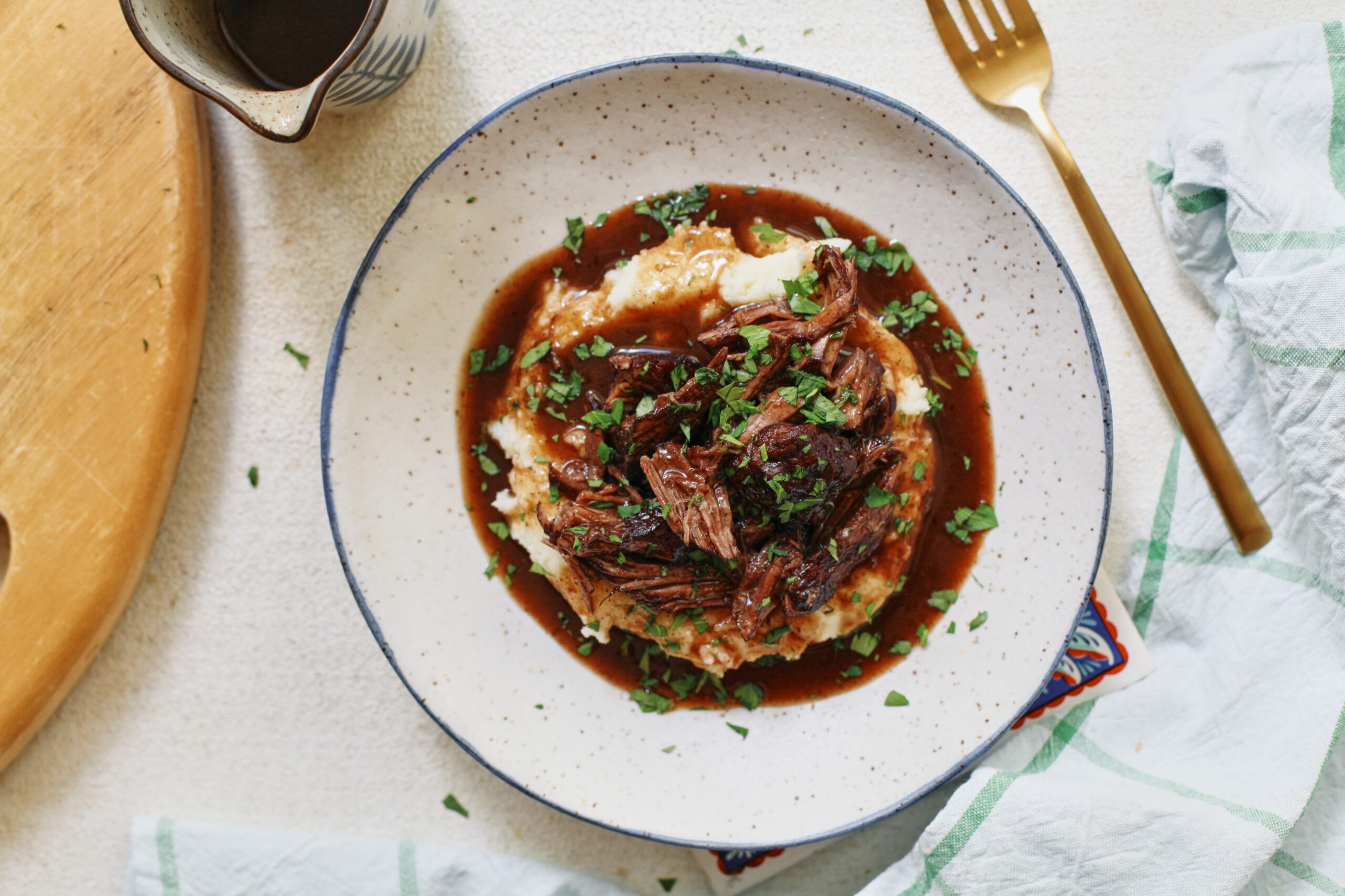 braised beef over mashed potatoes