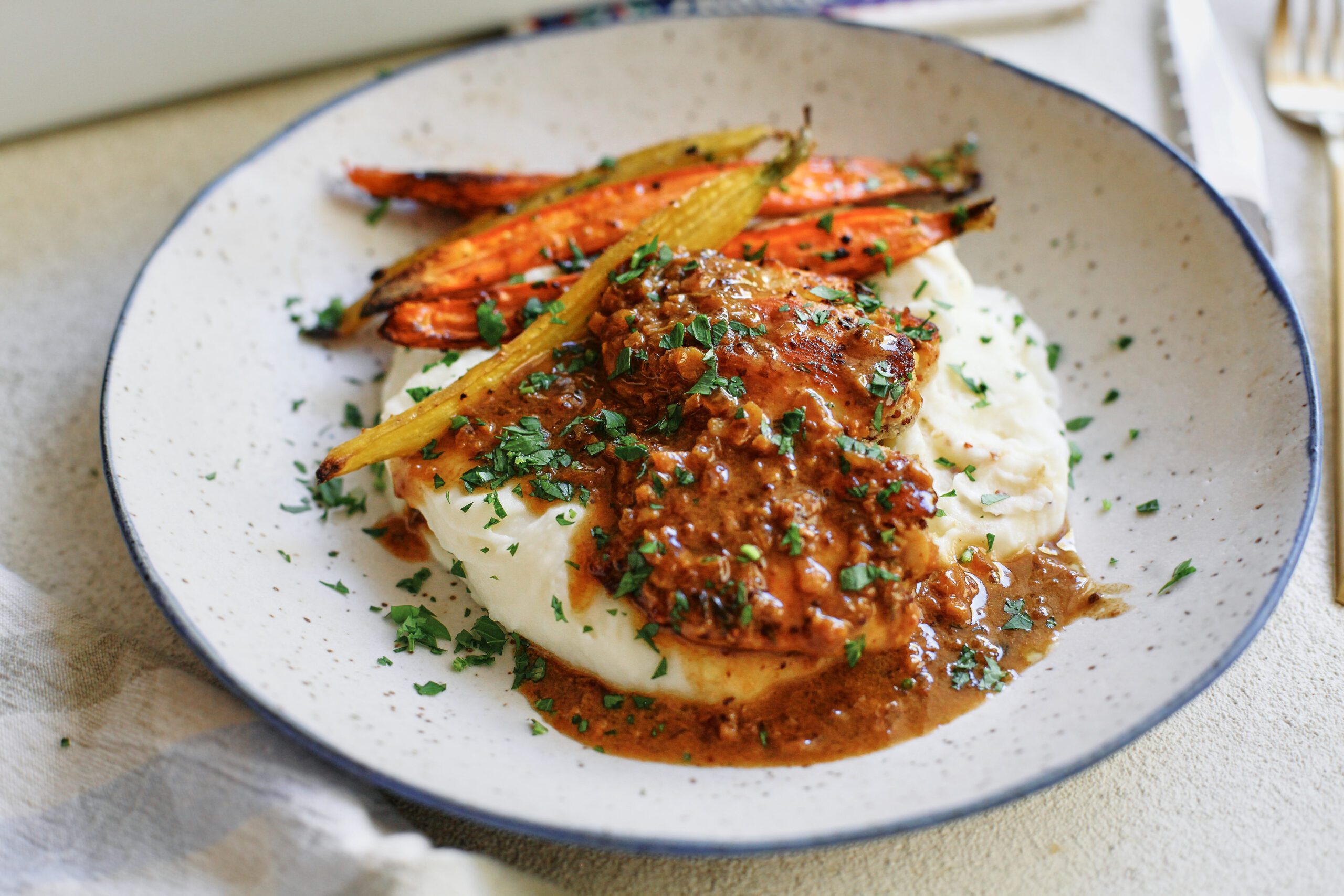 garlic herb chicken with honey butter carrots and mashed potatoes