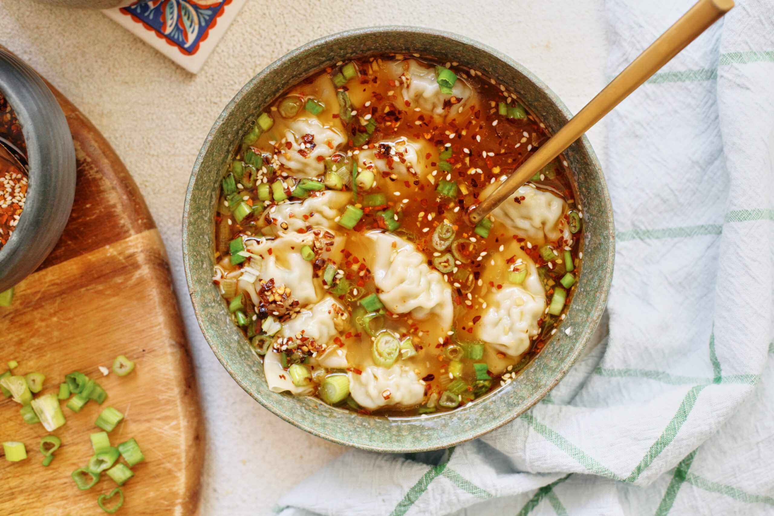 Wonton Soup 33 wonton soup topped with green onions and chili oil