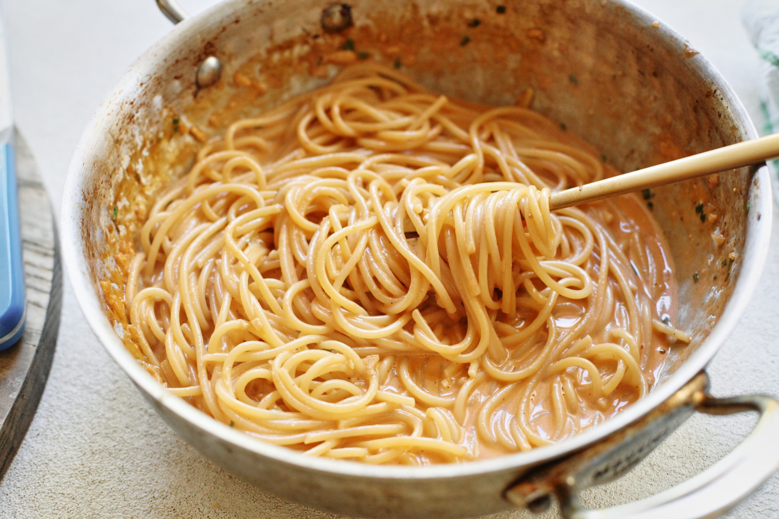 roasted garlic spaghetti being twirled on a fork
