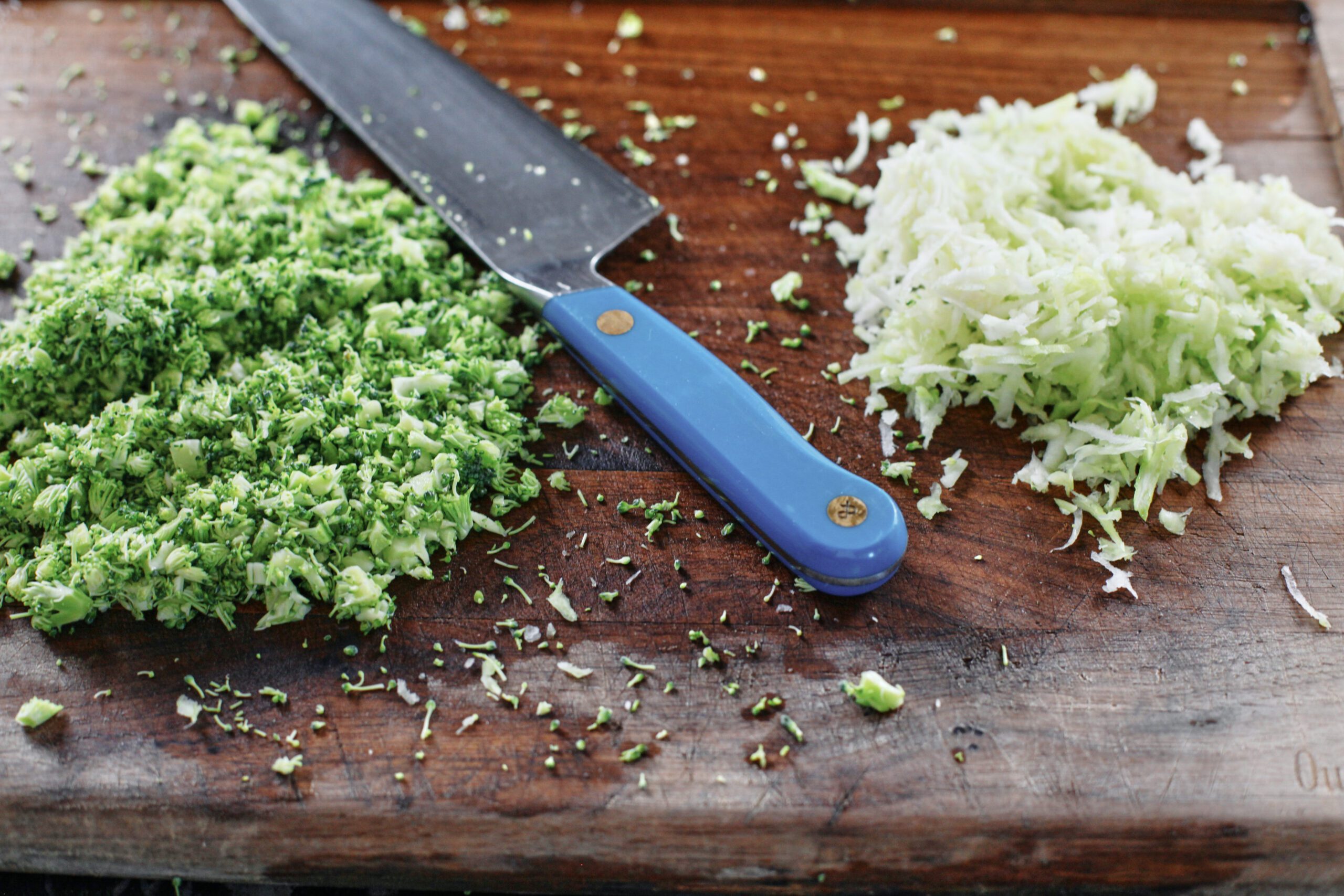 Broccoli Mac and cheese prep for the broccoli cheddar mac and cheese - grated broccoli stems and finely chopped broccoli florets