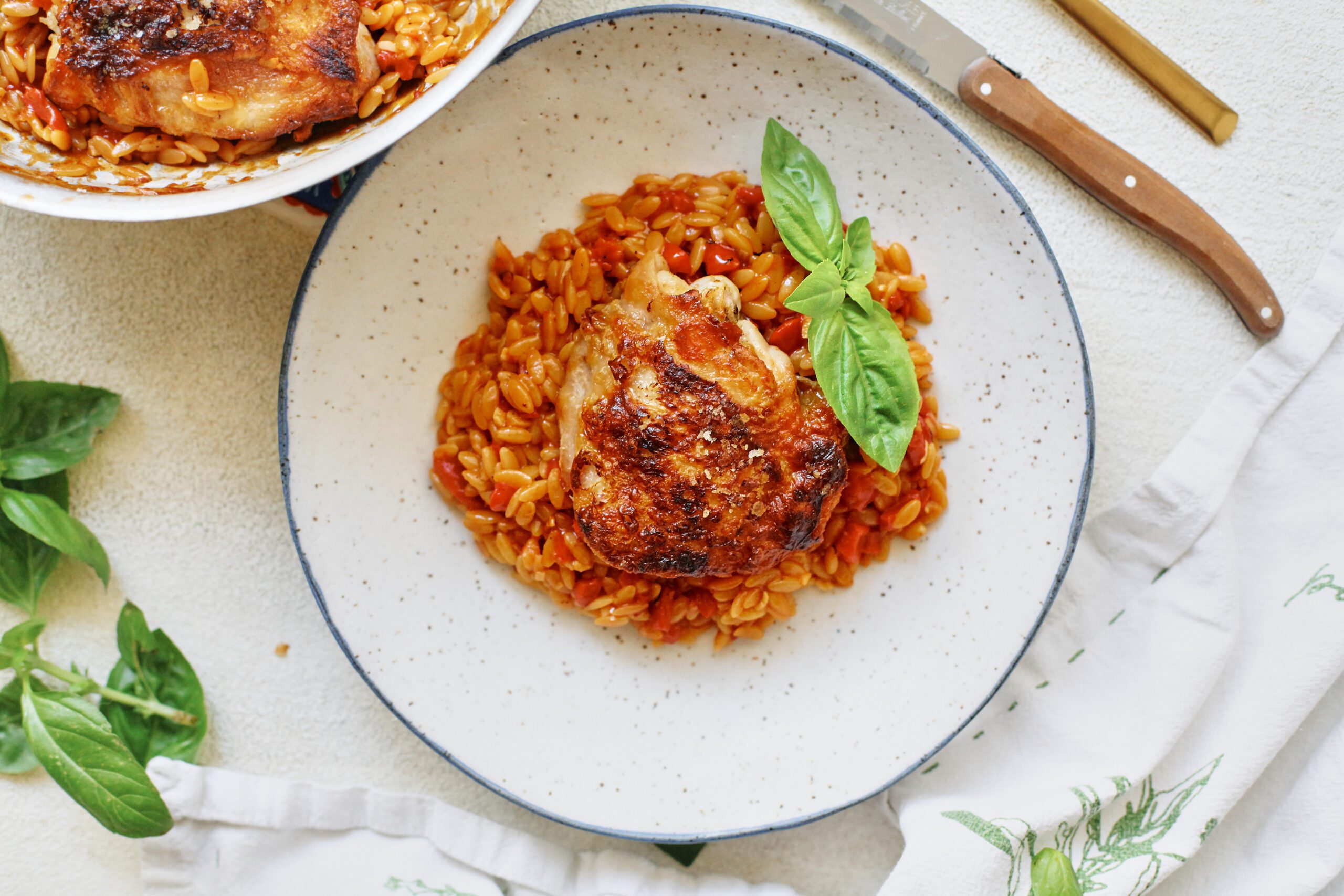 crispy chicken thighs with roasted red pepper orzo