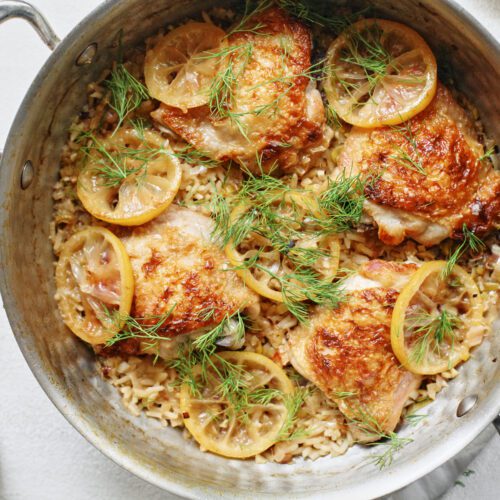 overhead photo of One Pot Lemony Dill Chicken and Rice in a deep hammered steel pan